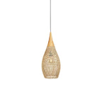 Natural rattan pendant light glowing warmly above a seating area
