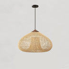 Natural rattan pendant light casting a dappled shadow pattern