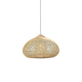 Handwoven natural rattan pendant light glowing over a room