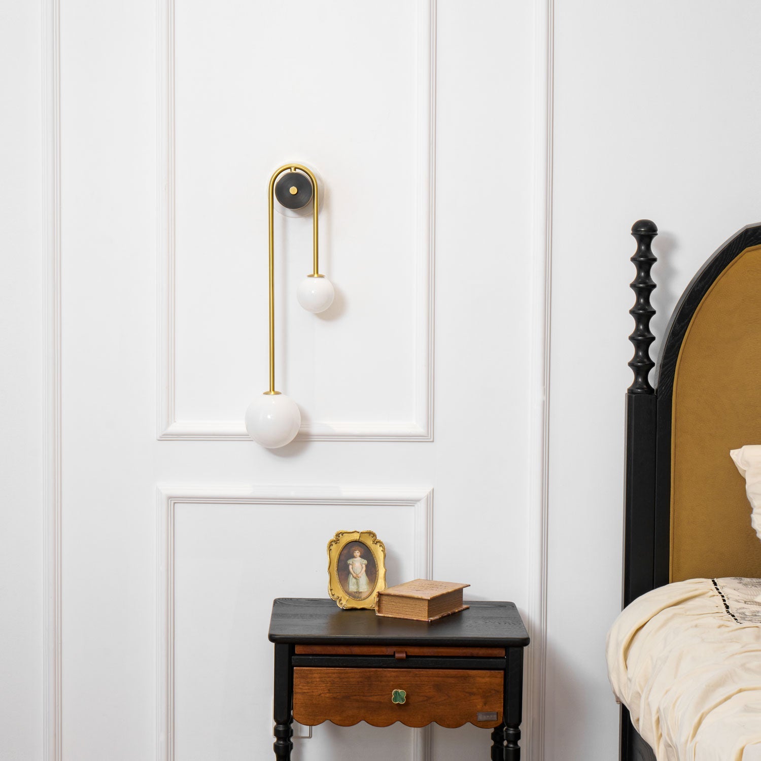 Brass arc wall light close up of upper glass shade