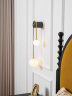 Brass arc wall light detail of the lower white glass shade