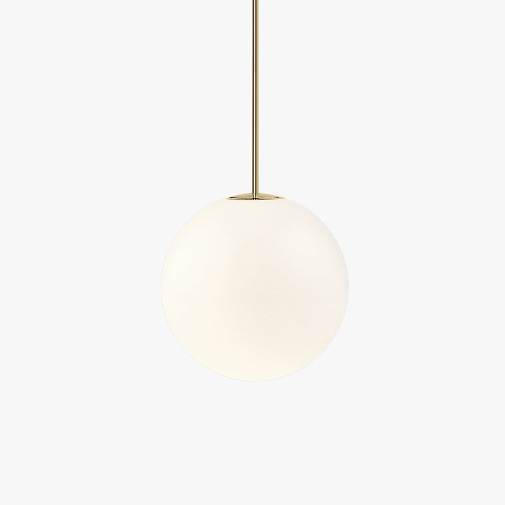 Single opal glass globe pendant on a slim brass rod indoors