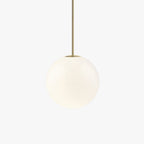 Single opal glass globe pendant on a slim brass rod indoors