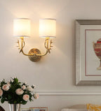 Brass deer head wall light shown mounted in an entryway