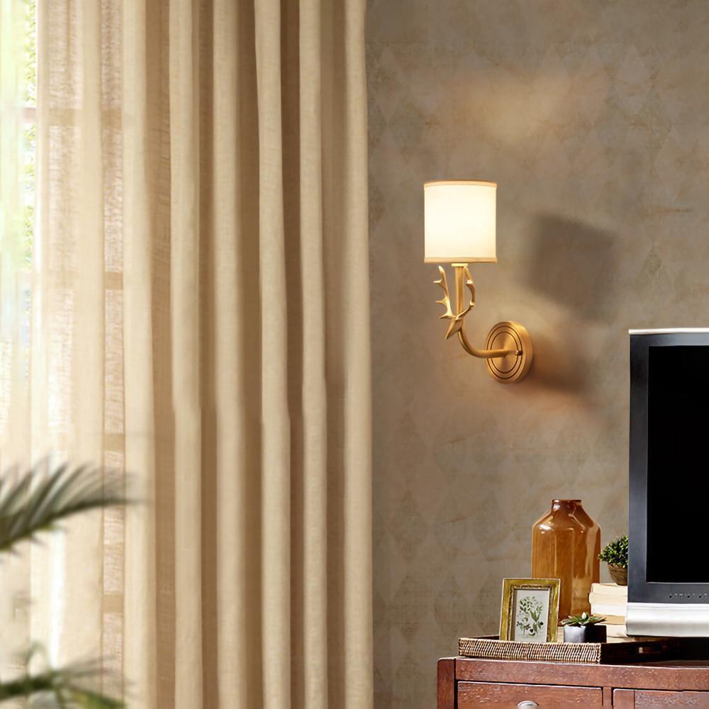 Brass deer head wall light with circular back panel and linen shades