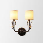 Brass deer head wall light with circular mounting panel on wall