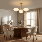 Persimmon chandelier detail of brass arms and glass globes