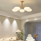 Brass and wood persimmon chandelier with white glass globes