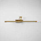 Gold frame light highlighting artwork with a soft warm glow