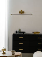 Gold frame light with touch dimmer lighting a painting warmly