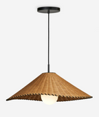 On a plain backdrop, this Clérachic pendant hangs lit from a slim cord and black ceiling cap.