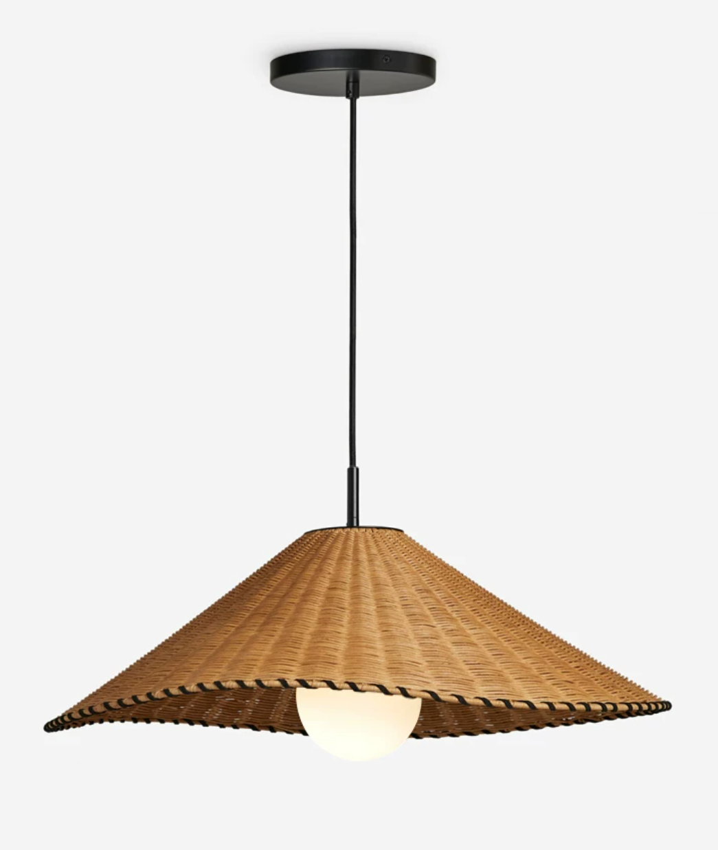 On a plain backdrop, this Clérachic pendant hangs lit from a slim cord and black ceiling cap.