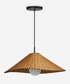 On a plain backdrop, this Clérachic pendant hangs unlit, its woven cone shade shown from below.