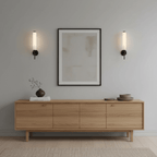 Wall sconce profile with tubular alabaster shade and brass support