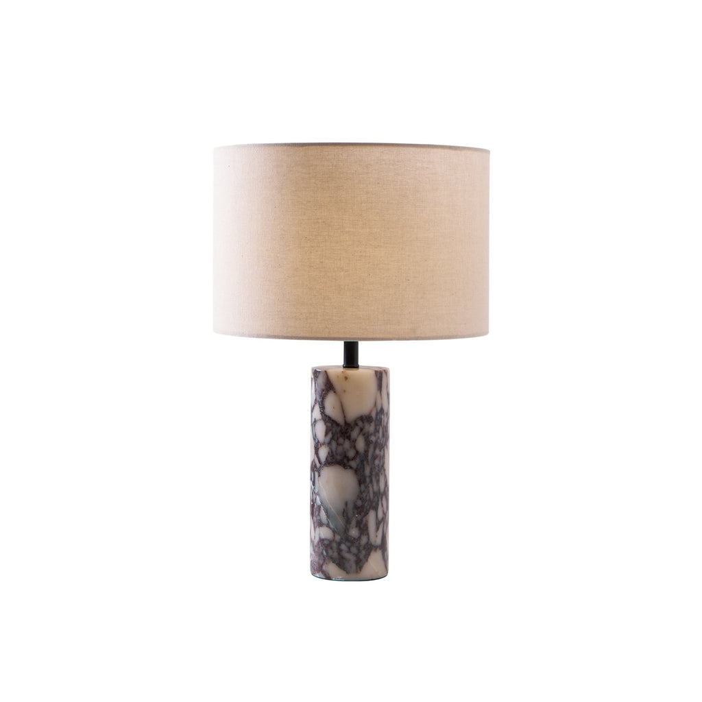 Clérachic marble table lamp set small in the upper frame against grey, with wide white space around it.