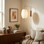 Spherical wall sconce showing chrome bracket and plug-in cord