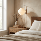 White ball wall sconce detail showing pull cord and chrome fitting