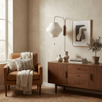 Round white wall sconce with warm glow and walnut accent ring