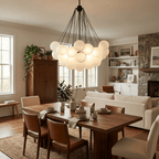 Cluster of hand-frosted glass globes lit as a cloud chandelier