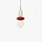 Tinted glass pendant light shade lit from within