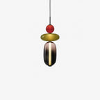 Tinted glass pendant lights casting a soft scattered glow