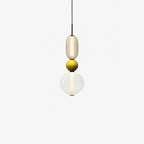 Cluster of coloured glass jar pendant lights hanging together