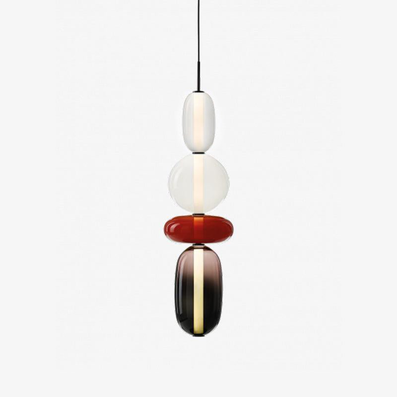 Mixed colour glass jar pendant lights glowing softly