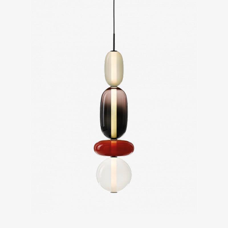 Tinted glass jar pendant light hanging from a black cable