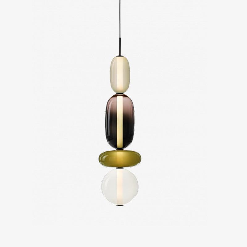 Coloured glass pendant light shade detail with warm LED glow