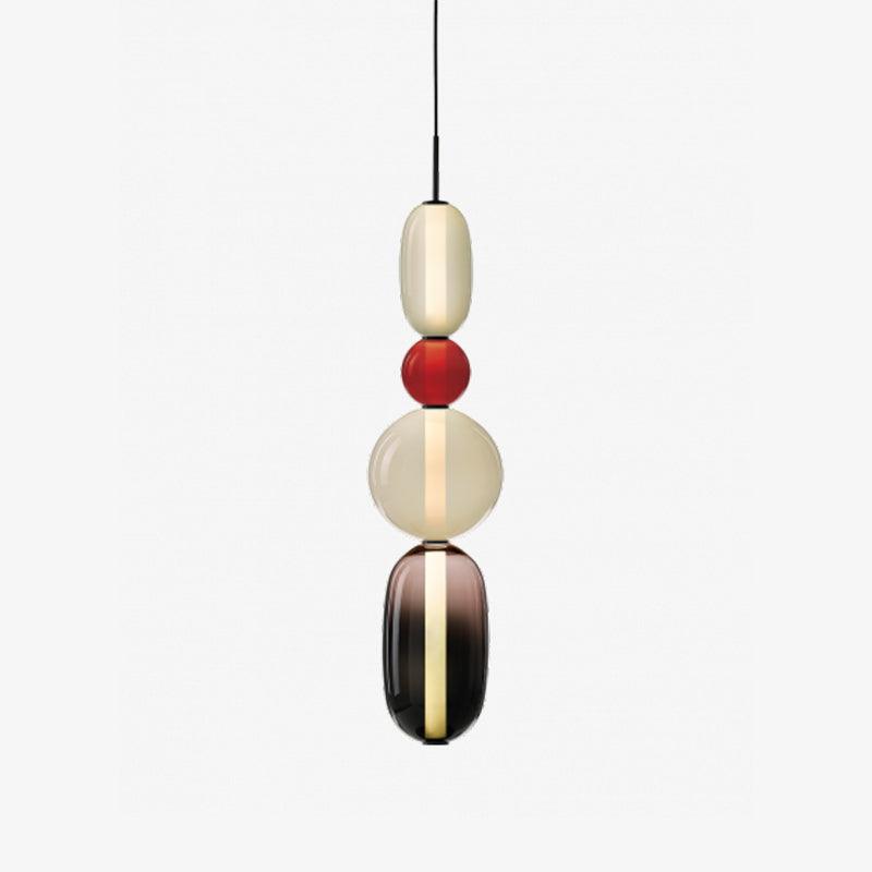 Coloured glass pendant lights hung at staggered heights