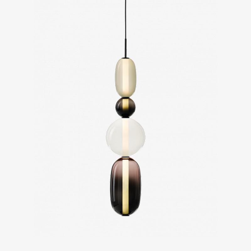 Tinted glass jar pendant lights glowing in a living space