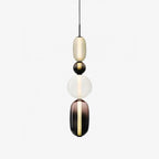 Tinted glass jar pendant lights glowing in a living space