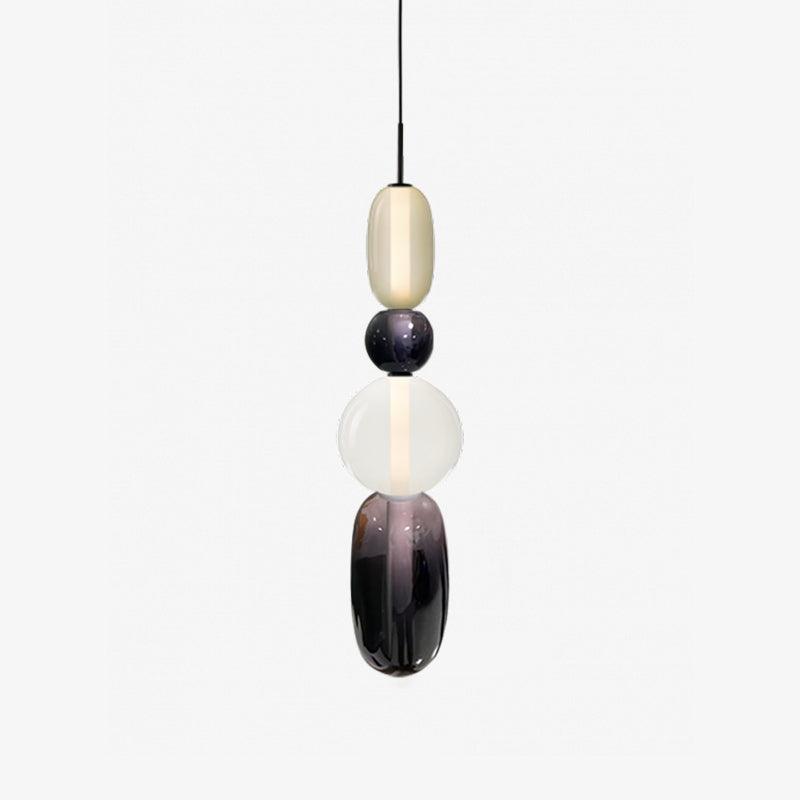 Glass jar pendant lights clustered above a seating area