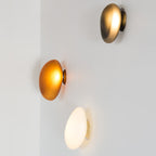 Translucent glass wall lamp glowing in a calm interior