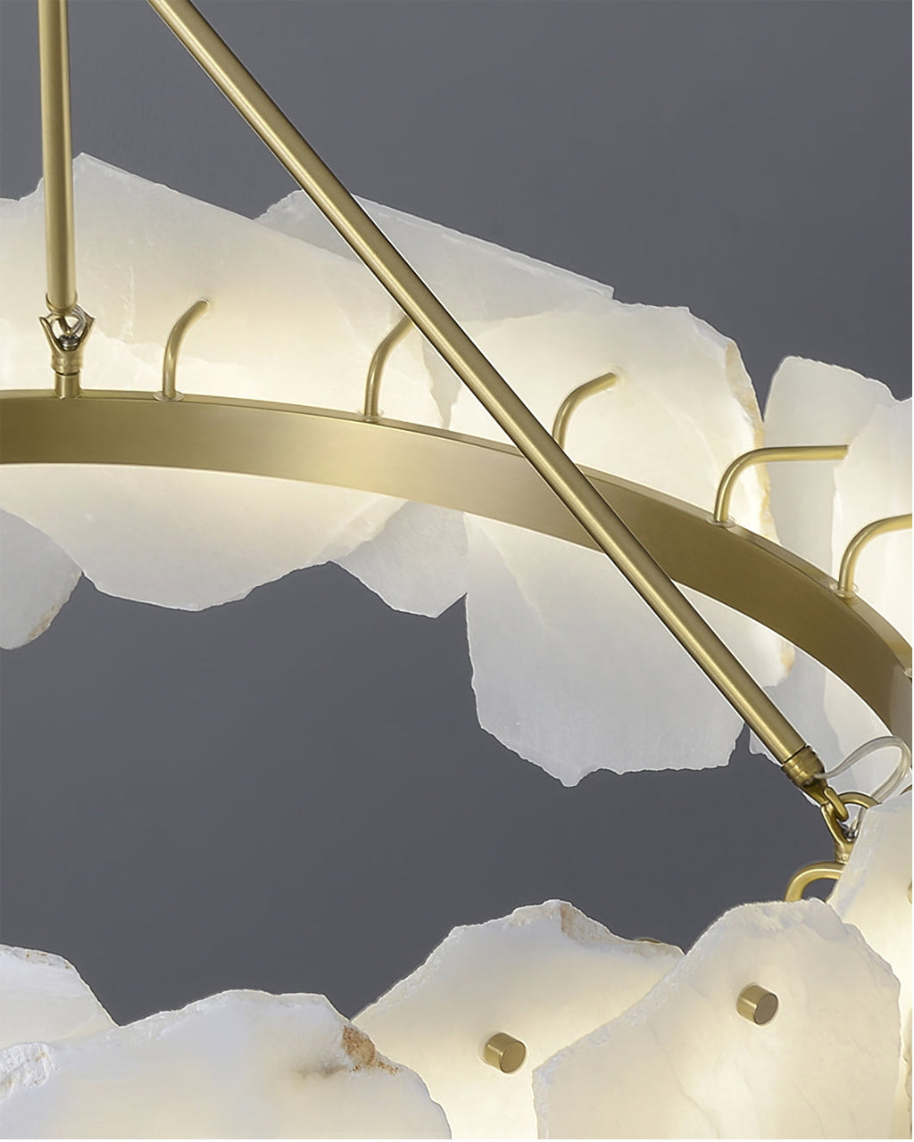 Close-up of the brass ring and support arm, with hooks that hold each alabaster plate in place