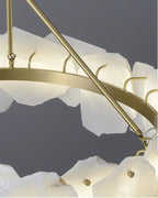 Close-up of the brass ring and support arm, with hooks that hold each alabaster plate in place