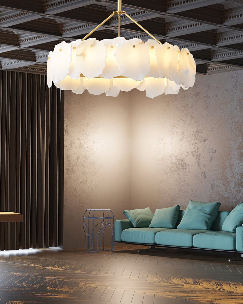 Burton chandelier under a coffered ceiling, lighting a lounge with a teal sofa and wood floor