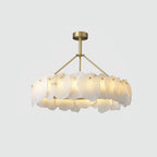 Round Burton alabaster chandelier shown straight on, brass hardware pinning each stone plate