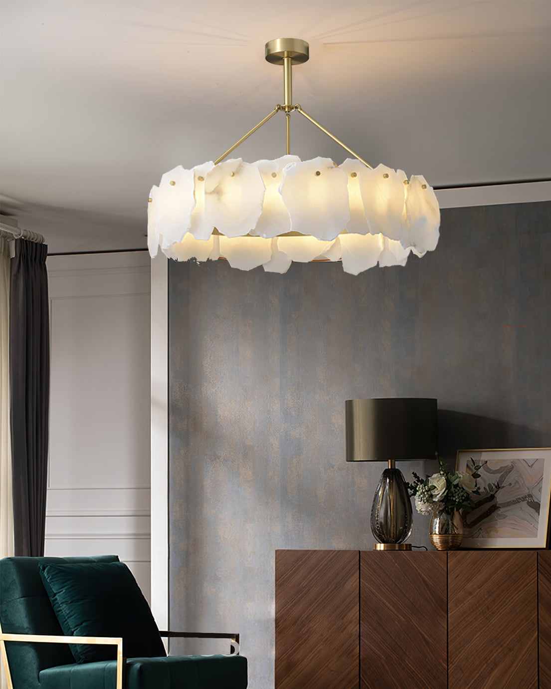 Burton chandelier lit above a walnut sideboard in a living room with a slate-blue feature wall