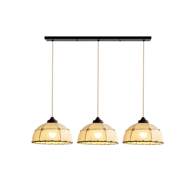 Three of these Clérachic pendants hang from one linear plate, their quilted shades and rope trim shown against white.