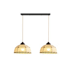 Two of these Clérachic pendants hang side by side from a linear plate, shades lit against a plain backdrop.