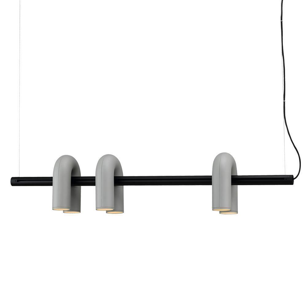 Cirkus chandelier U-heads glowing in a contemporary setting