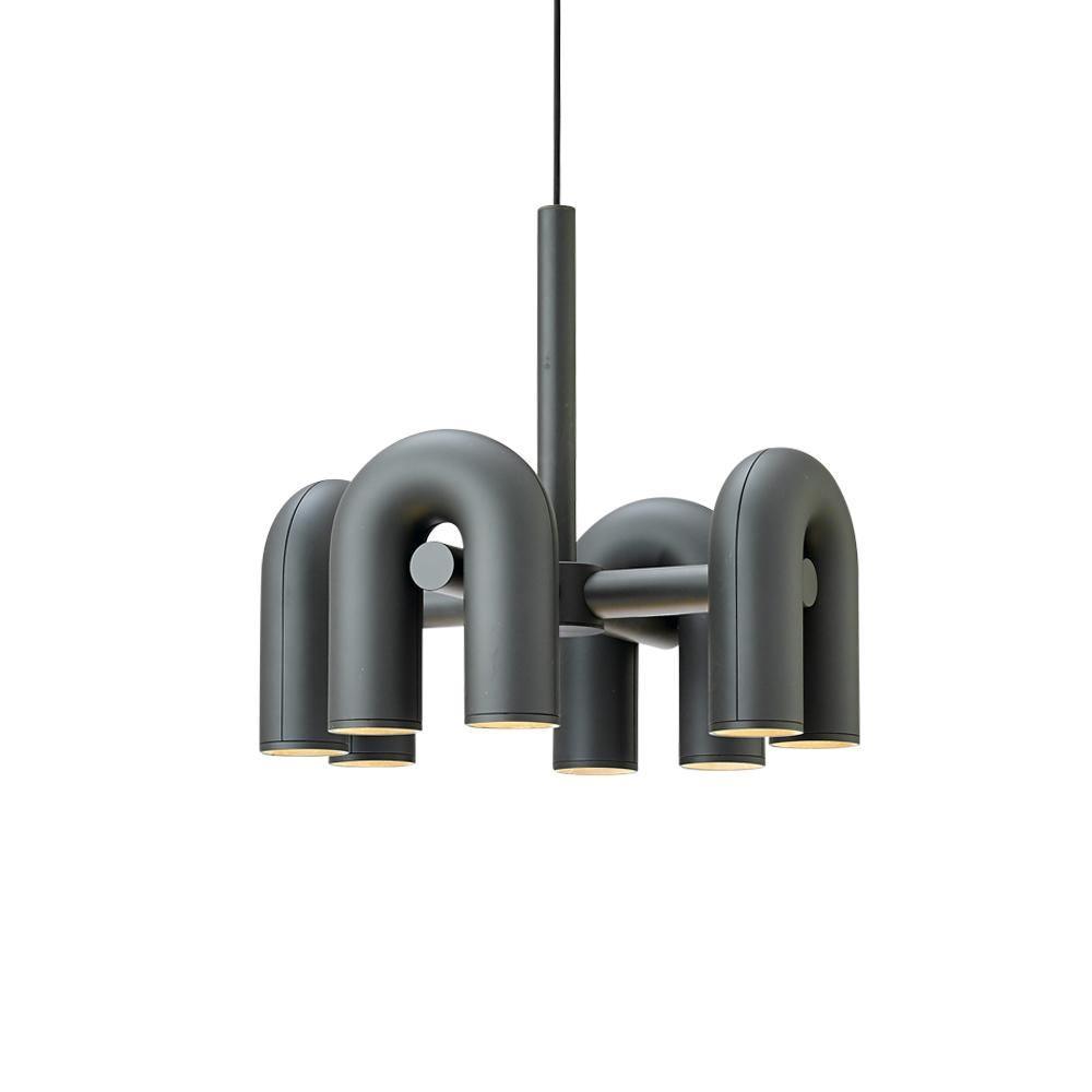 Cirkus chandelier with movable U-shaped heads lit in a modern room