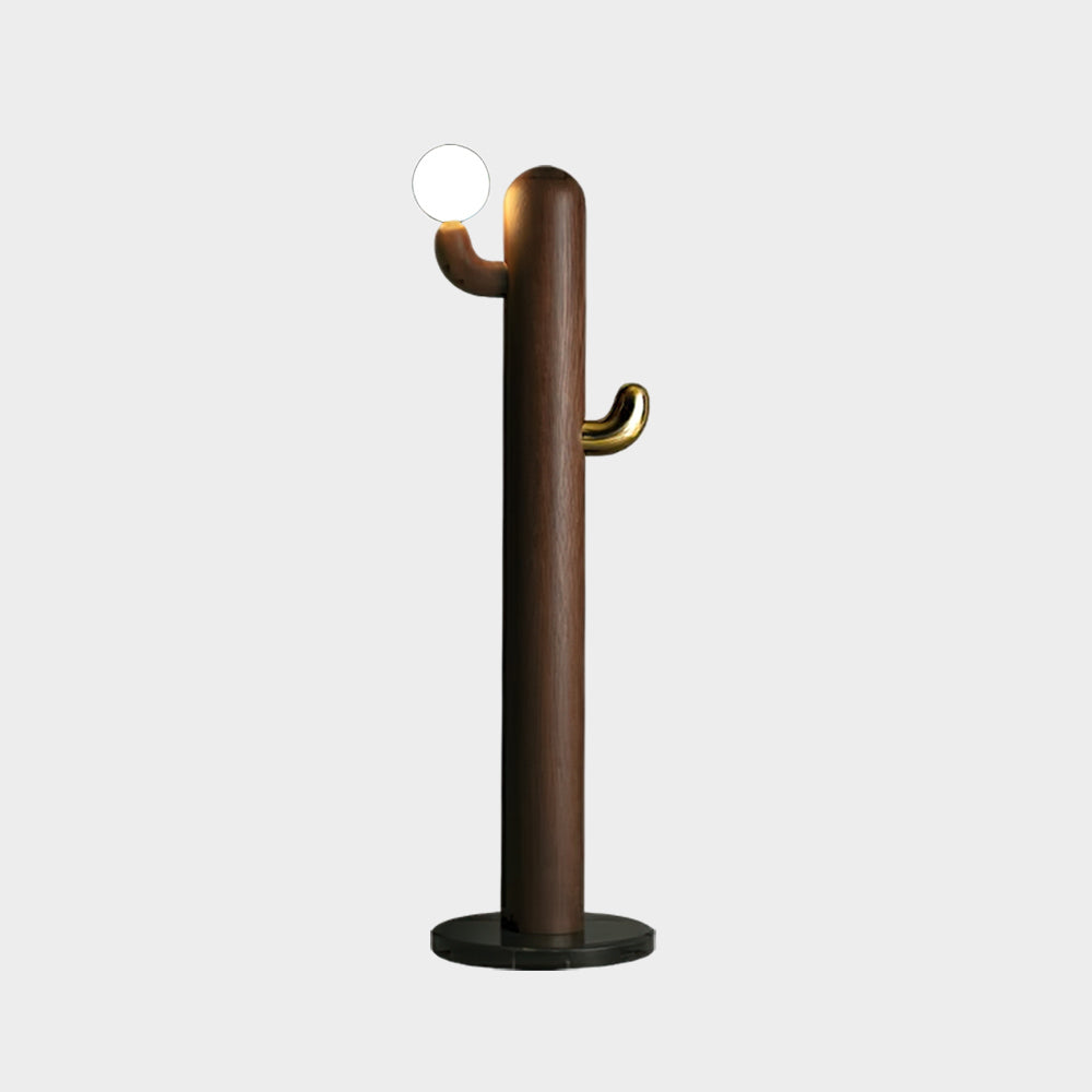 Walnut-toned Clérachic floor lamp with a lit glass orb, shown isolated on a plain grey studio background.