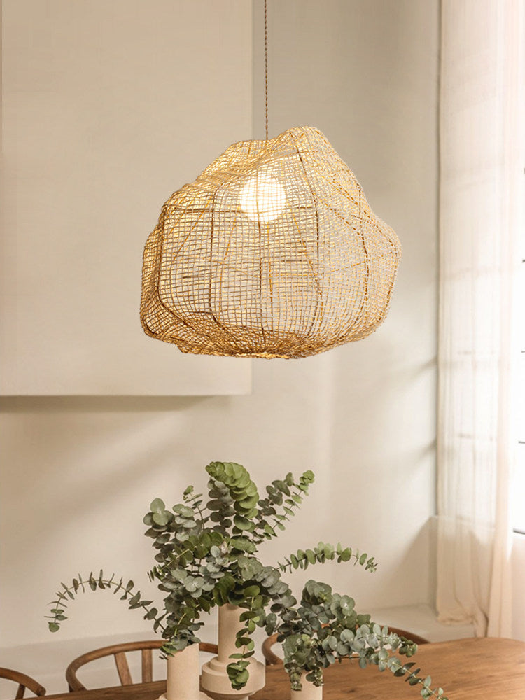 This Clérachic pendant hangs in a sunlit corner beside a loose bouquet of eucalyptus stems.