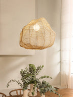 This Clérachic pendant hangs in a sunlit corner beside a loose bouquet of eucalyptus stems.