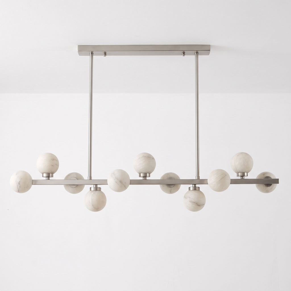 Studio shot of this Clérachic chandelier in brushed nickel, alabaster balls alternating above and below the bar.