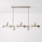 Studio shot of this Clérachic chandelier in brushed nickel, alabaster balls alternating above and below the bar.