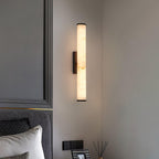 Brass alabaster wall sconce in a calm minimalist interior