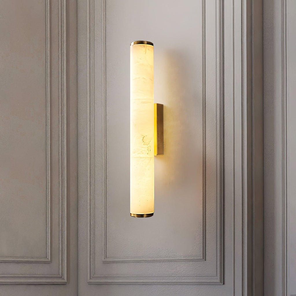 Close view of alabaster wall sconce shade and brass mount